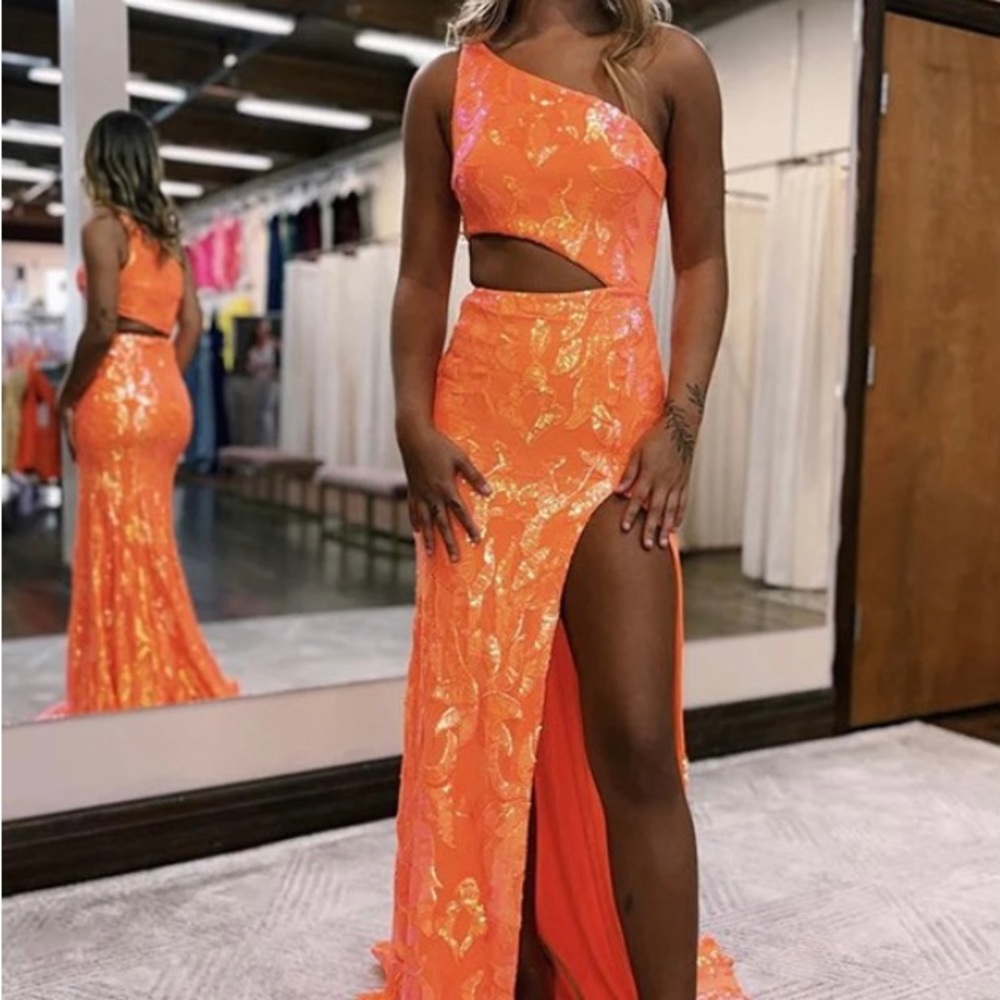 Never been worn! Beautiful off shoulder Orange formal dress with sequins.
